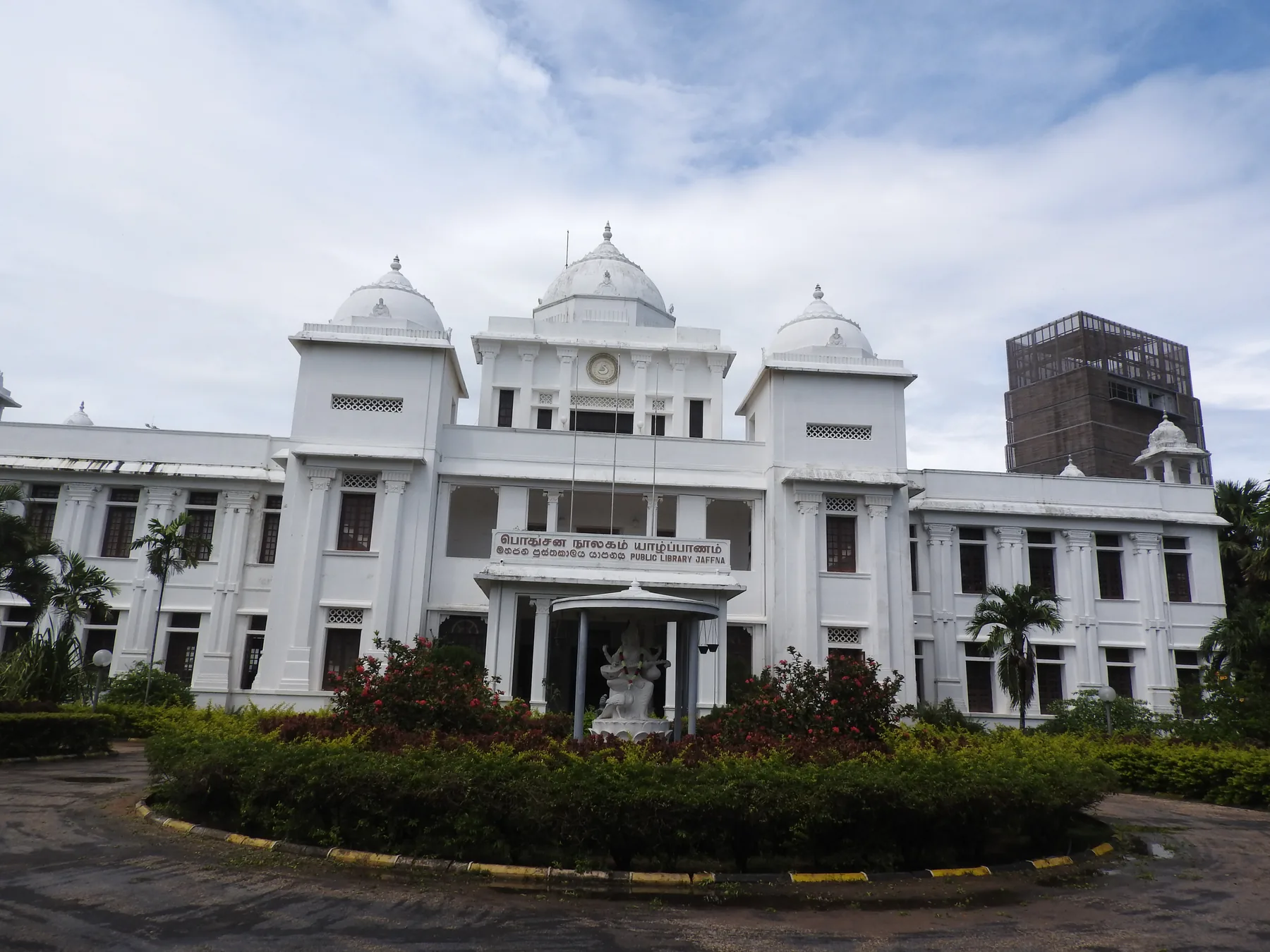 Jaffna Public Library, a white colonial-era building with domed towers, seen from its garden entrance.